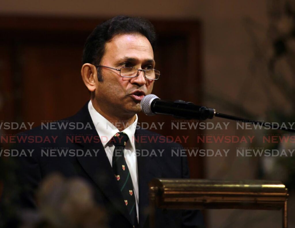 Dr Ramesh Mootoo Jr, son of Dr Romesh Mootoo, former Mayor of San Fernando, reads the eulogy at the funeral service held at J.E Guides funeral home on Coffee street San Fernando. The service was officiated by Surendra Maharaj. - Photo by Lincoln Holder