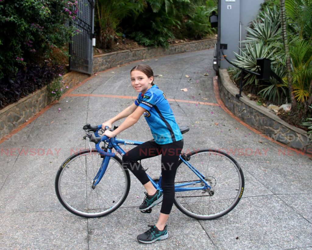 Leah De Freitas gets set to ride as part of her training as a triathlon athlete.  - AYANNA KINSALE