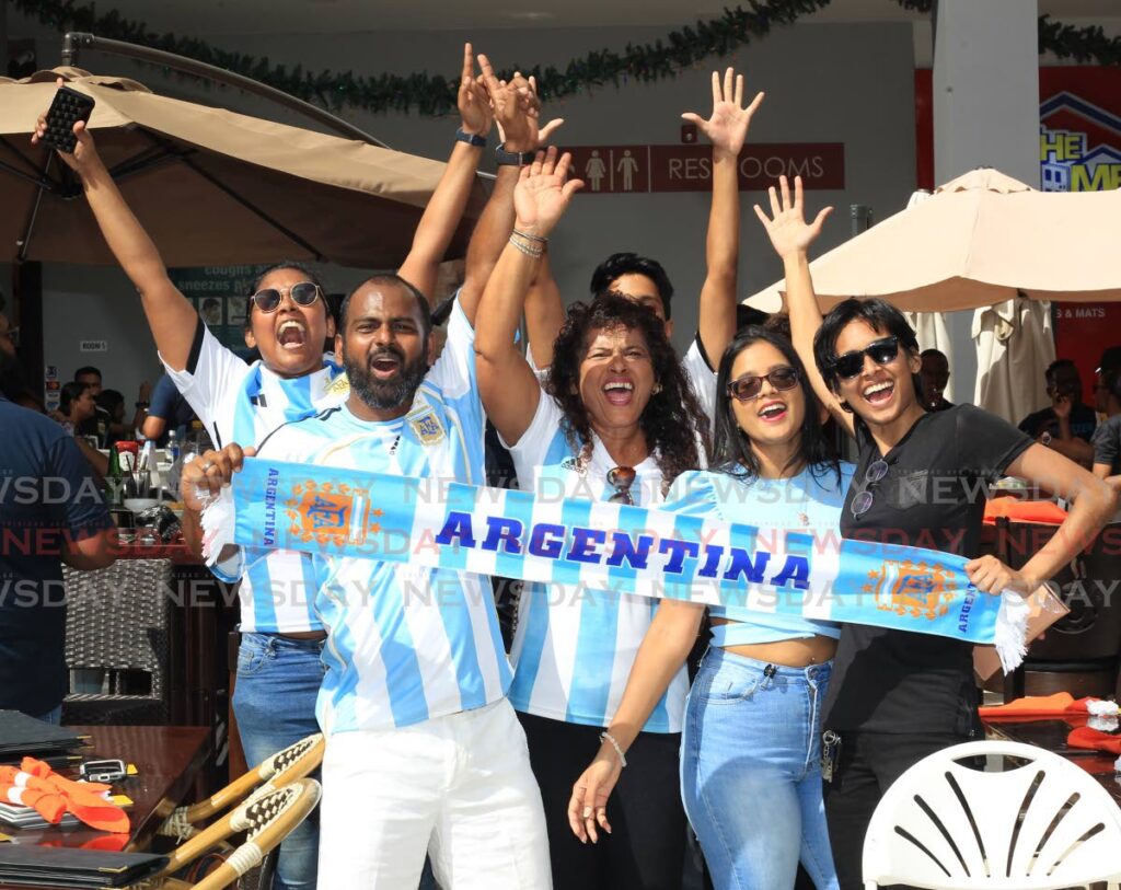 Football fans came out in their numbers to the courtyard of C3 Shopping Centre, San Fernando, to watch this year’s World Cup final between Argentina and France on Sunday afternoon.  Photo by Roger Jacob