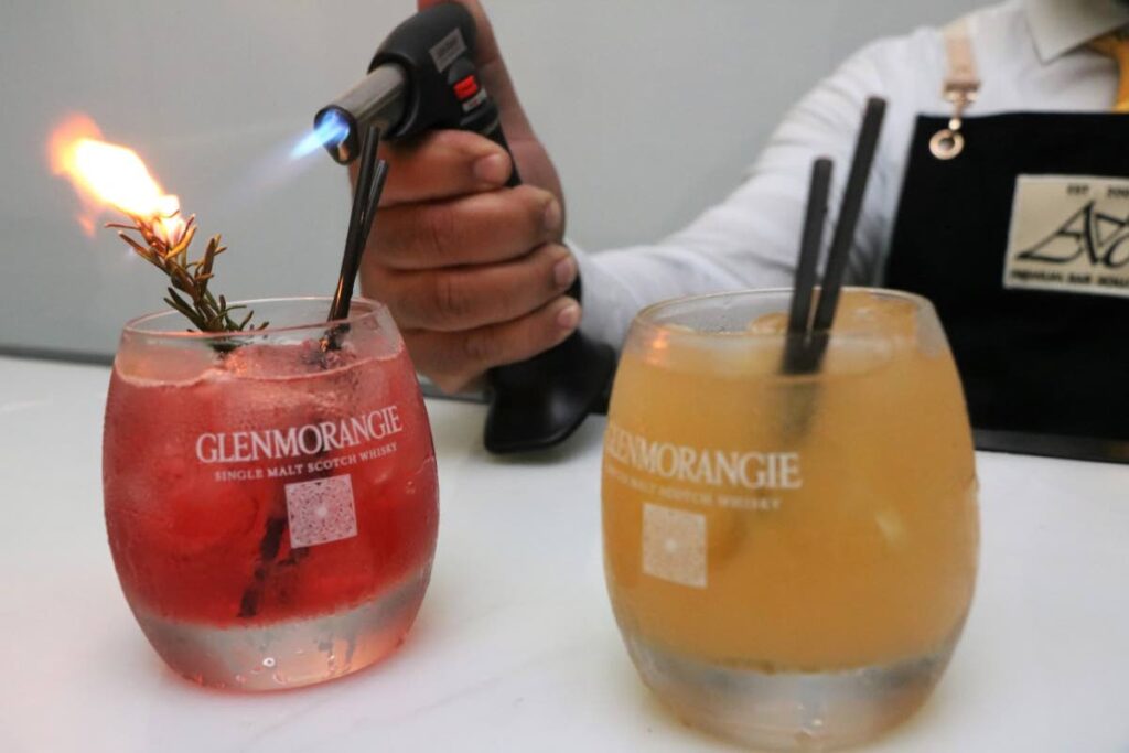 An Ace bartender heats up a cocktail made with Glenmorangie Single Malt Scotch Whisky. Photo courtesy Overtime Media