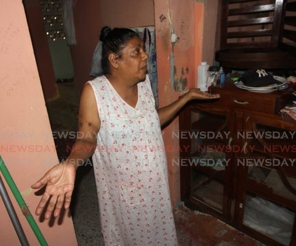 Virginia Ramkissoon said she still still struggling to pick up the pieces after her Jaffar Street, Bamboo Village house was flooded out. Photo by Angelo Marcelle