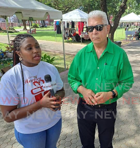 Port of Spain mayor Joel Martinez, right, with councillor for Northern Port of Spain and committee's chair Abena Hartley at Woodford Square for the Port of Spain City Corporation's Christmas in D Square week-long artisan market on Thursday.  - Andrew Gioannetti