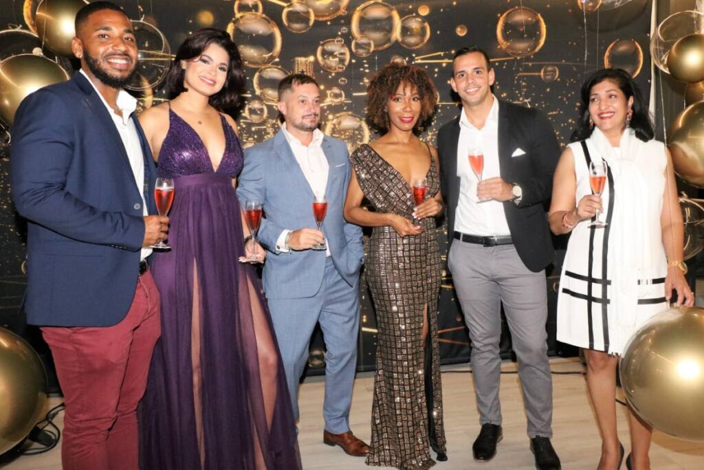 A S Bryden and Sons’ product specialist Nicholai Solomon, and senior brand manager, wines and champagne, Arveyann Dillon, with Moët Hennessy's market manager for the Caribbean Alexandre Helaine, Moët & Chandon brand manager Sabrina Celestin;, A S Bryden and Sons Ltd key account manager Brad de Gannes, and marketing manager Marsha Matadeen.  - courtesy Overtime Media