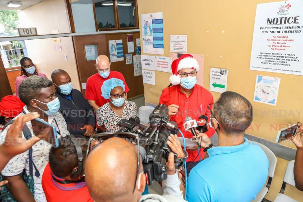 Health Minister Terrence Deyalsingh speaks with the media at the maternity ward of the Port of Spain General Hospital on Christmas Day. - JEFF K MAYERS