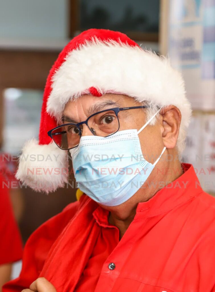 Health Minister Terrence Deyalsingh in his Xmas gear during a visit to the PoS General Hospital on Christmas Day.