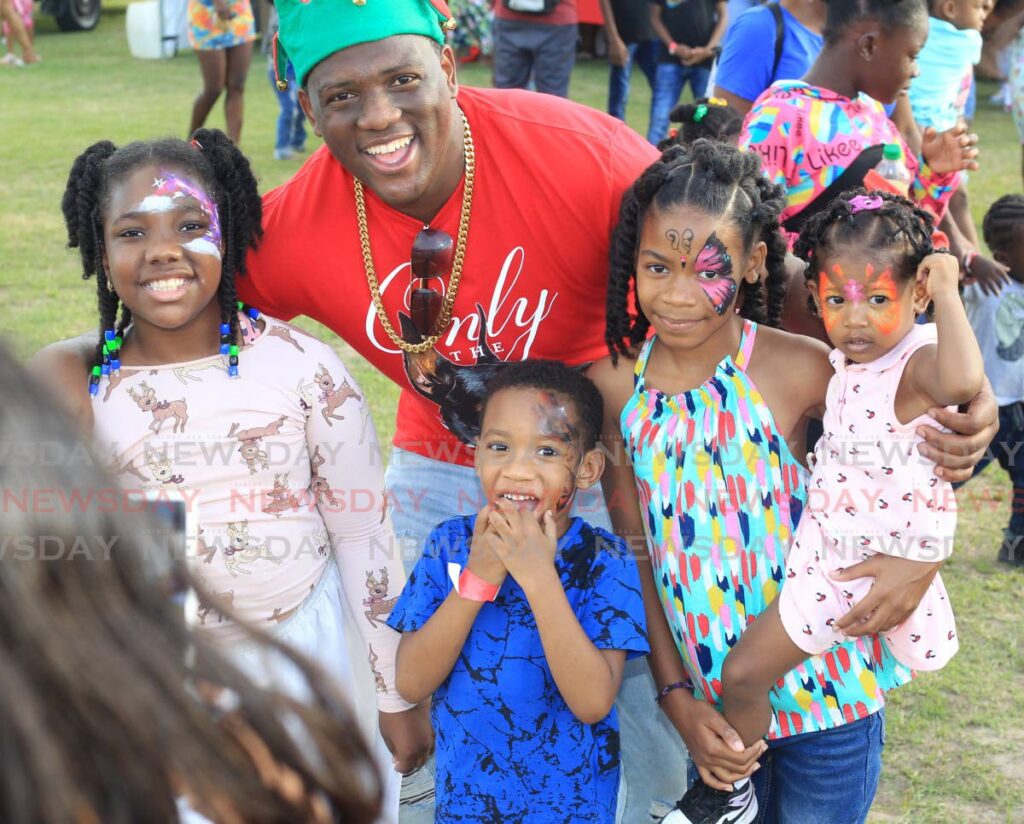 FILE PHOTO: Kareem Marcelle with children at a community Christmas event at Beetham Gardens on December 26. - 