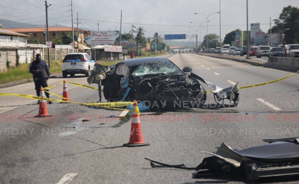 One person was killed and two others injured in this accident near UWI traffic lights on the Churchill Roosevelt Highway, on Tuesday morning. - Photo by Sureash Cholai