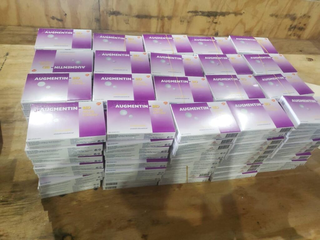 ILLEGAL: Boxes of illegally-procured Augmentin antibiotics which were among a consignment of illegal medication which were seized at the bond in central Trinidad during a raid by police and Customs and Excise officers on Thursday. Photo courtesy TTPS