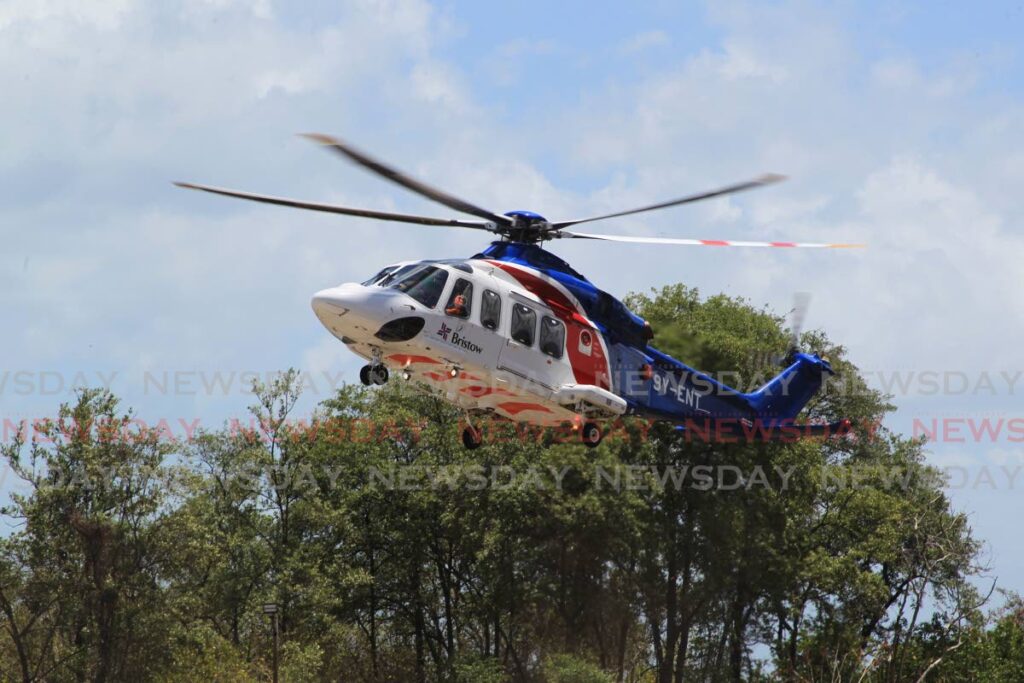 A helicopter operated by Bristow  prepares to land at the National Helicopter Service Heliport, Audrey Jeffers Highway, St James on May 21, 2020. Photo by Roger Jacob