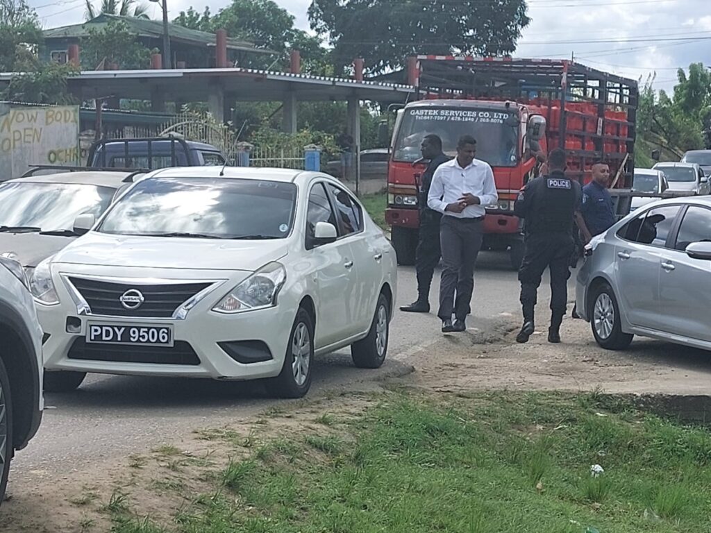 Police at the scene where a car with two suspects were intercepted at Debe Trace, Debe, after PC Zaid Mohammed was shot dead at Katwaroo Trace, Penal on Monday morning. 
Photo by Lincoln Holder