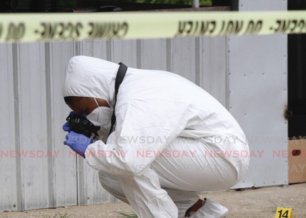 A crime scene  investigator. - File photo