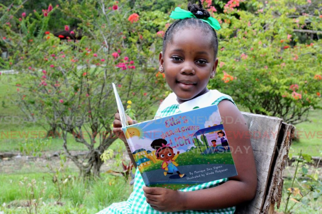 Jalayah George reads a book at the Botanical Gardens, Port of Spain on March 16, 2022. - FILE PHOTO/ROGER JACOB