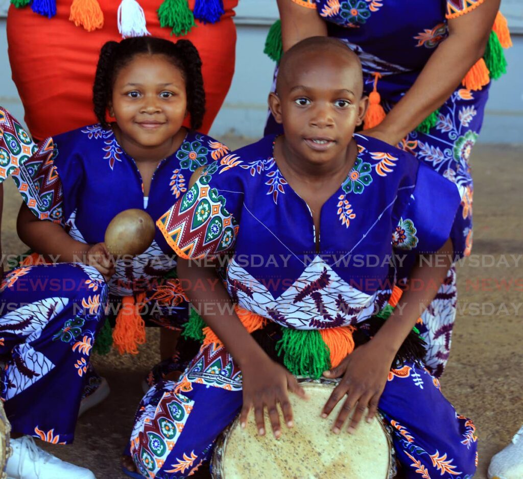 Janay  Mortley, left and Kofi Thomas of the Ancestors Beyond drummers during the Rhythm and Voices of Africa Concert at the Emancipation Village, Port of Spain. - SUREASH CHOLAI