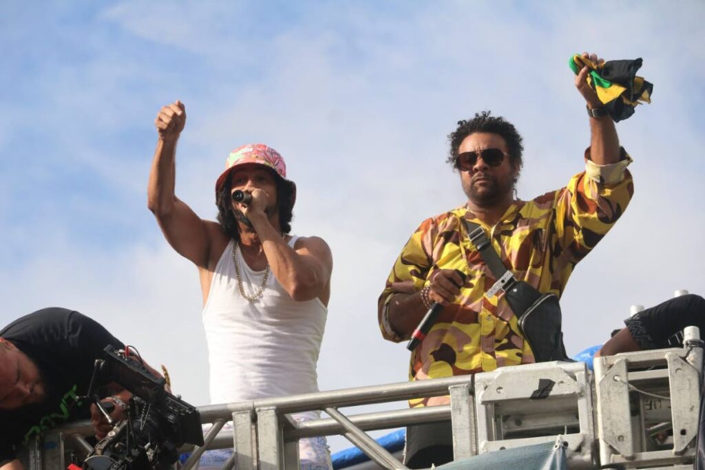 Kees Dieffenthaller, left, and Shaggy perform their new song Mood while filming scenes for the music video atop a truck from the mas band, Gen X, during the Miami Broward One Carnival parade of the bands on October 9, 2022. Photo courtesy Overtime Media