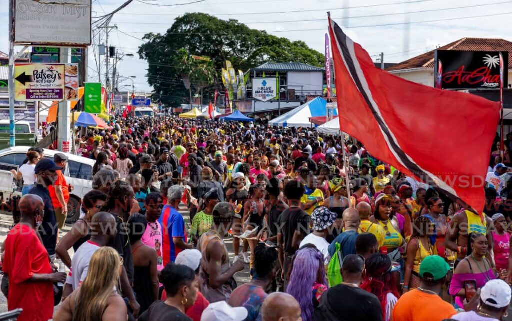 Thousands of revellers on the road in Crown Point to enjoy the inaugural Tobago carnival last October. File photo/David Reid