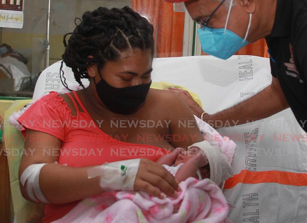 IT'S A GIRL:  Health Minister Terrence Deyalsingh visited Venezuelan Jaira Marin at the San Fernando General Hospital on Sunday. Marin delivered her baby girl at 3.19 am on January 1.  - Photo by Marvin Hamilton