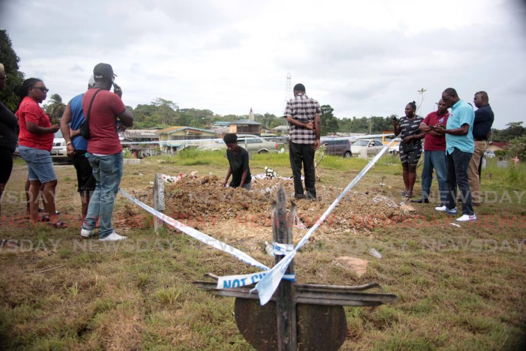 CORDONED OFF: Police cordoned off the grave of Whitney Bourne on Wednesday to allow gravediggers unhindered access to dig after the woman's final resting place was desecrated. Photo by Lincoln Holder