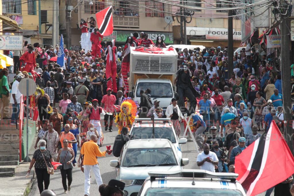 HOMECOMING: Hundreds of people accompanied the procession in Black Stalin's honour in San Fernando on Thursday. Photo by Lincoln Holder