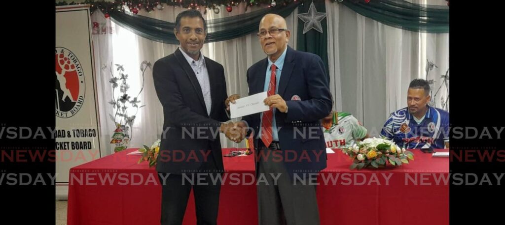 TTCB president Azim Bassarath, right, receives a $100k cheque from Senior North/South Classic sponsor Dale Baboolal of Soca Kings.  Photo by Jonathan Ramananansingh