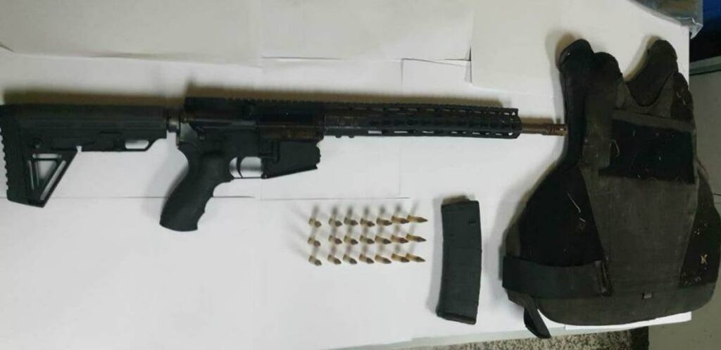 An AR-15 rifle, ammuniton and bullet-proof vest police seized in the Western Divison on January 6.  - Photo courtesy TTPS