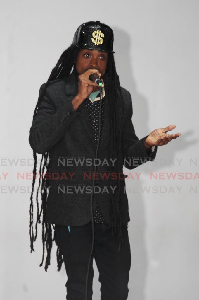 Moses Charles performs Woman, during auditions for the NACC Young King competition on Saturday at the Creative Arts Centre in San Fernando. 