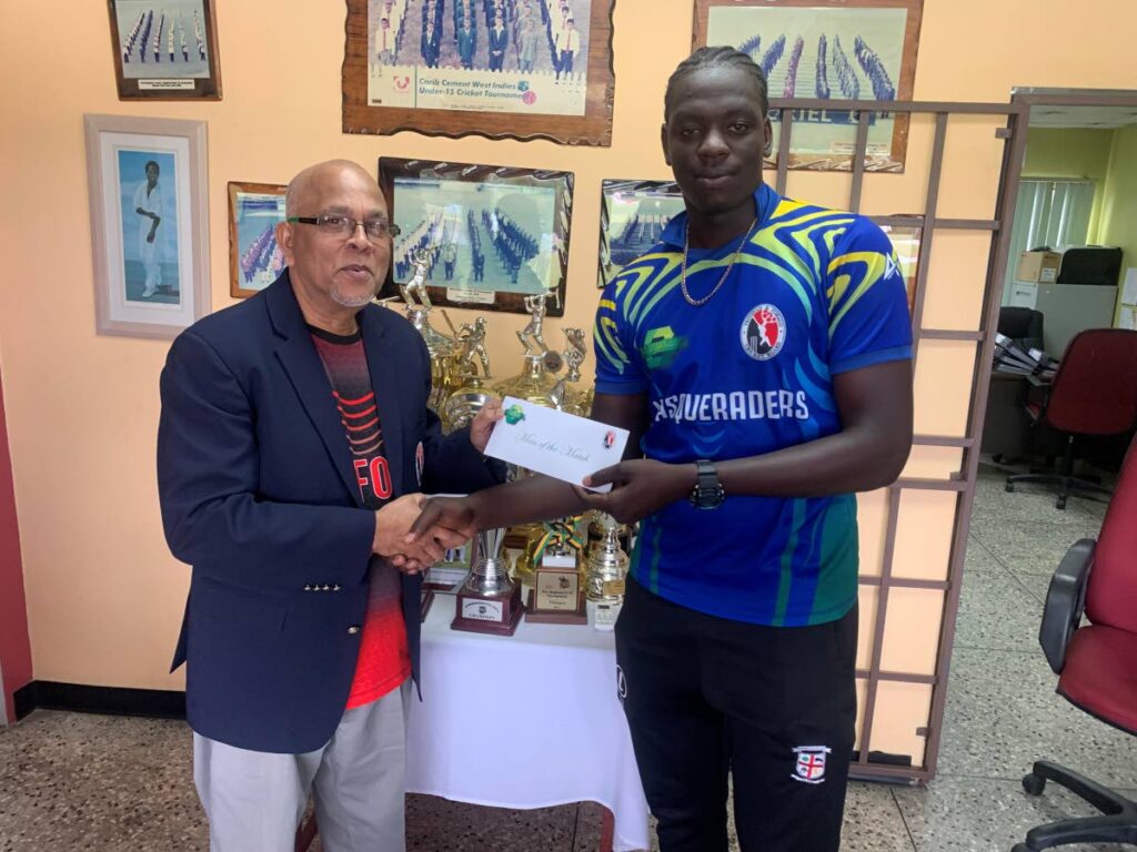 The TT Cricket Board gave an additional prize to the six man of the match awardees in the three preliminary rounds of the Namalco Under-23 Cup. In photo, the president of the TTCB, Azim Bassarath, left, hands over a $350 cheque to Masqueraders captain Joshua James on Saturday for his outstanding match-winning century on Wednesday. - 