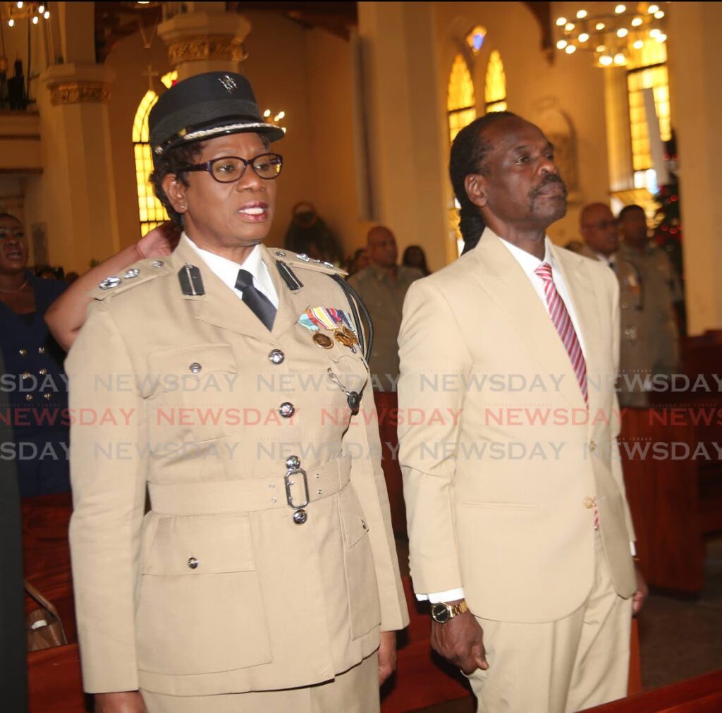 Acting Commissioner of Police Erla Christopher and National Security Minister Fitzgerald Hinds stand during the inter-faith service.