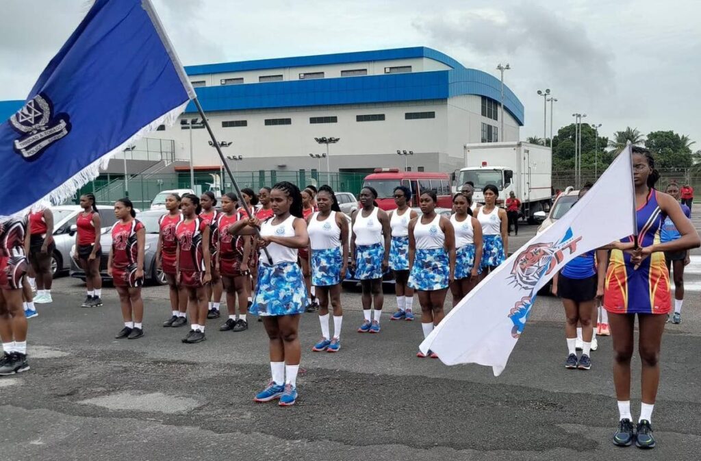 Teams line up during the march past segment at the opening of the Courts All Sectors Netball League. 