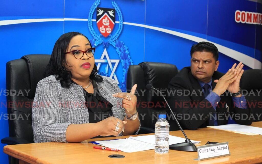 Supt Claire Guy-Alleyne, of the police's Special Victims Department and Superintendent Rishi Singh of the Homicide Department at a media conference at Police Headquarter, Port of Spain, on Thursday. - ROGER JACOB