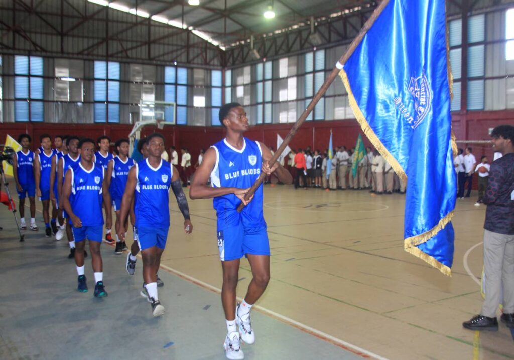 Schools basketball teams parade during the launch of the Secondary School Basketball League season on Friday, at Woodbrook Youth Facility.  - Photo by Roger Jacob