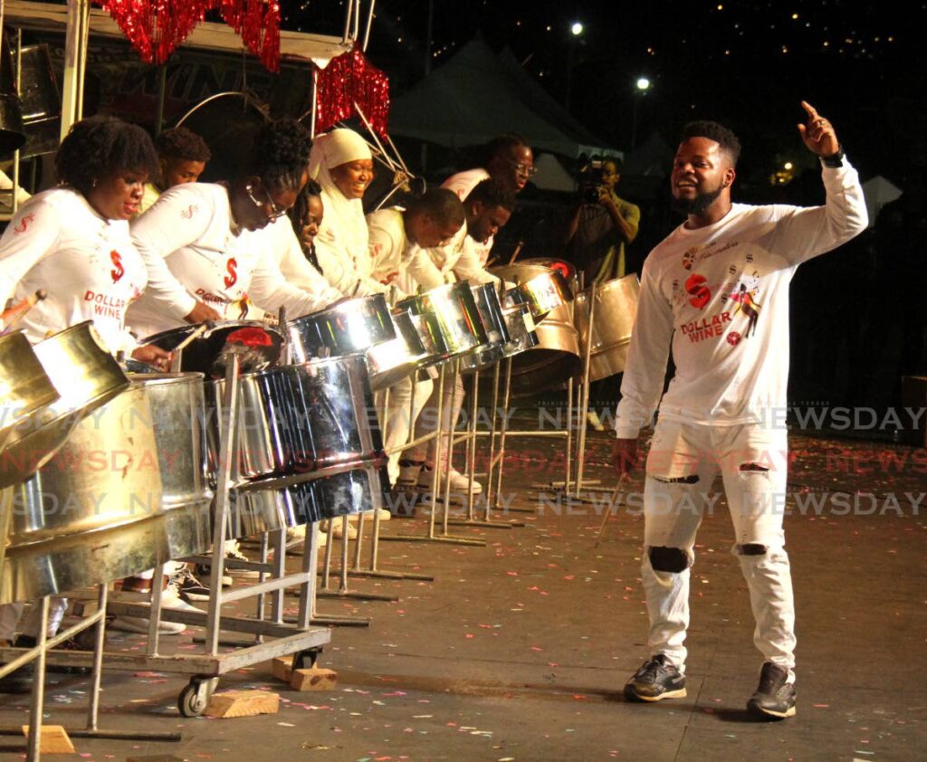 Uptown Fascinators arranger Ojay Richards, right, conducts the band during their performance of Dollar Wine by Colin Lucas during the Panorama small conventional bands finals at the Queen’s Park Savannah, Port of Spain, Saturday. Photo by Ayanna Kinsale