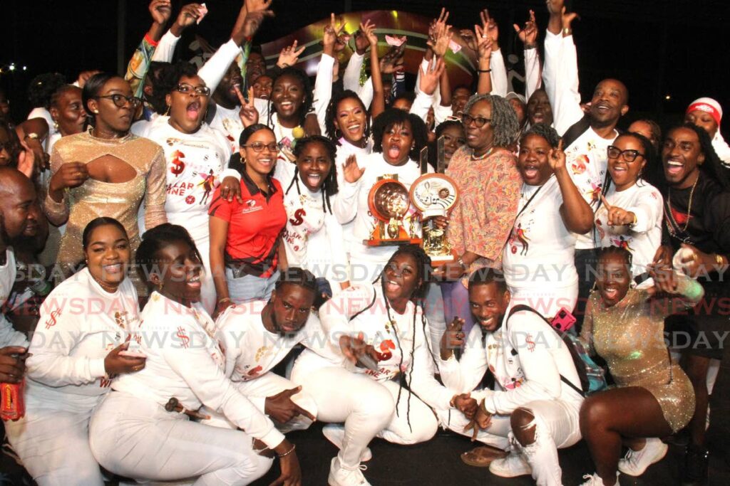[MAIN] Pan Trinbago President Beverley Ramsey-Moore celebrates with Uptown Fascinators Steel Ochestra after their winning performance of Dollar Wine by Colin Lucas during the Panorama Small Conventional Steel Orchestra finals at the Queen’s Park Savannah, on Saturday.  Photo by Ayanna Kinsale