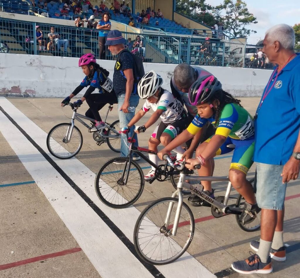 Riders line up for a race at the TTCF development meet on Saturday at the Arima Velodrome.  - TTCF