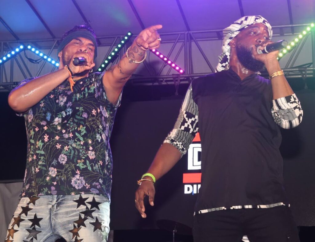 Raymond Ramnarine, left, and Dil E Nadan vocalist, Stephen Marcelle perform at Expressions fete in Debe.  - 