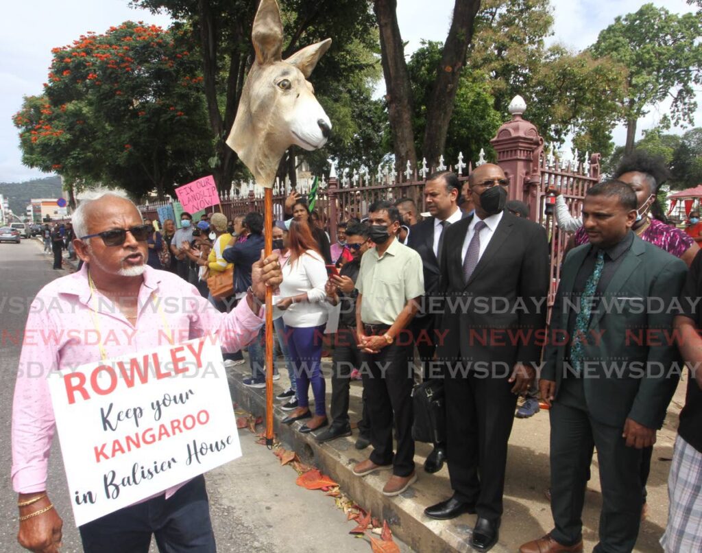 UNC councillor Doodnath Mayrhoo and other supporters protest opposite the Red House before the Electoral College met to elect a new President on Friday. - Angelo Marcelle