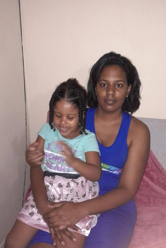 Shivon Scipio holds her four year old daughter Samyiah Miracle Ramkissoon after they were rushed to the Sangre Grande Hospital on January 5, when Samyiah suffered seizures. Photo courtesy TTPS