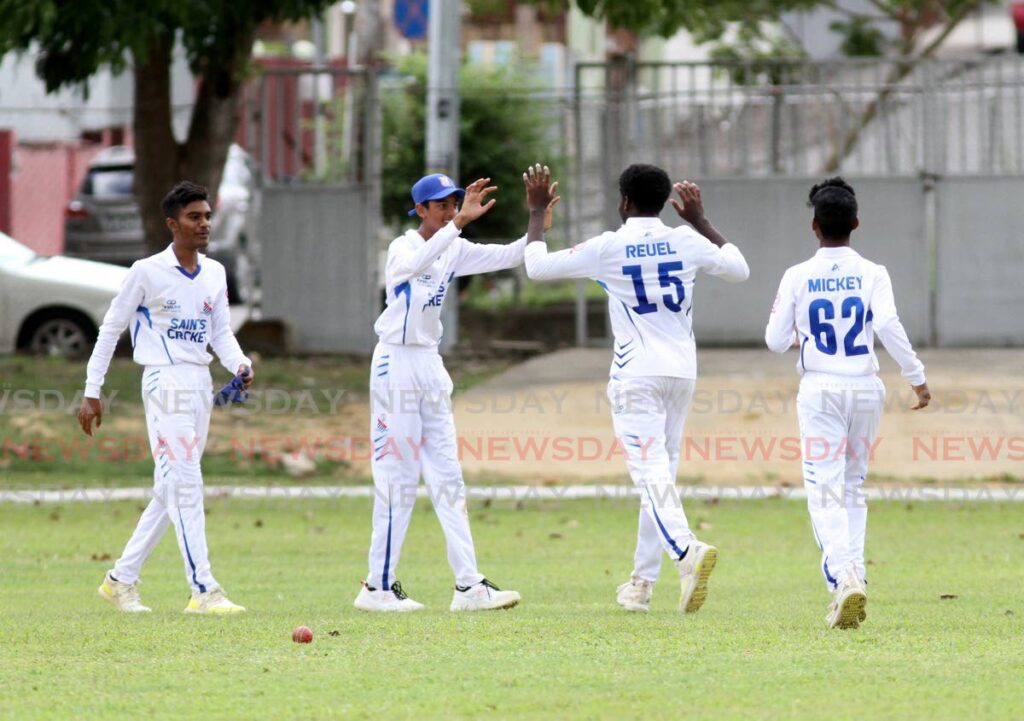 St. Mary’s College teammates celebrate after taking a wicket against Naparima Boys College during the Secondary Schools’ Cricket League match, on Thursday, at Naparima Grounds, San Fernando.  - AYANNA KINSALE