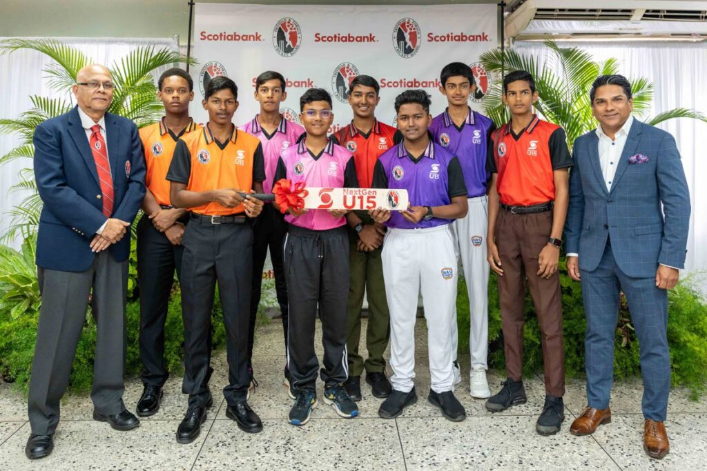 TTCB president Azim Bassarath, left, and Scotiabank Foundation director Peter Ghany with some participants in the Scotiabank NextGen U15 Cricket Programme 2023. Photo courtesy Scotiabank