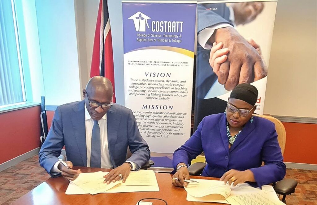President of COSTAATT Dr Keith Nurse and  interim CEO Tourism Trinidad Limited Carla Cupid sign the MOU on January 26.  - Photo courtesy Tourism Trinidad Ltd