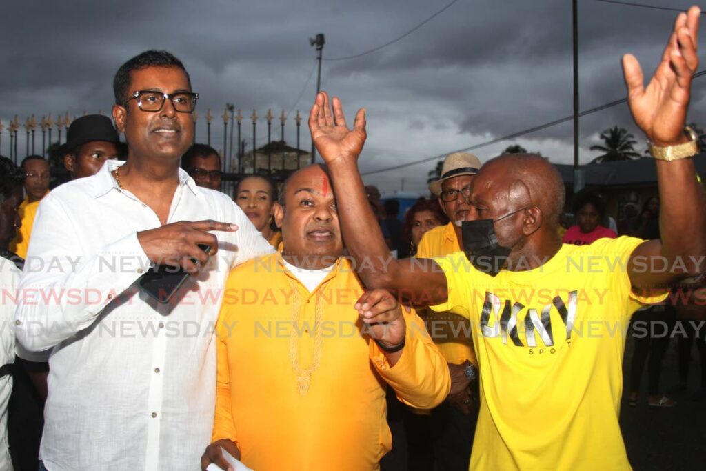 UNC supporters square off with attorney Larry Lalla and Pundit Donny Samlal at the UNC's national congress in Couva on Sunday. - Marvin Hamilton