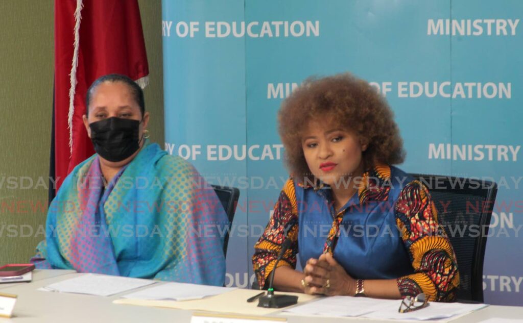 Education Minister Dr Nyan Gadsby-Dolly speaks at the press conference on Monday. At left is minister in that ministry Lisa Morris-Julien. PHOTO BY ROGER JACOB - 