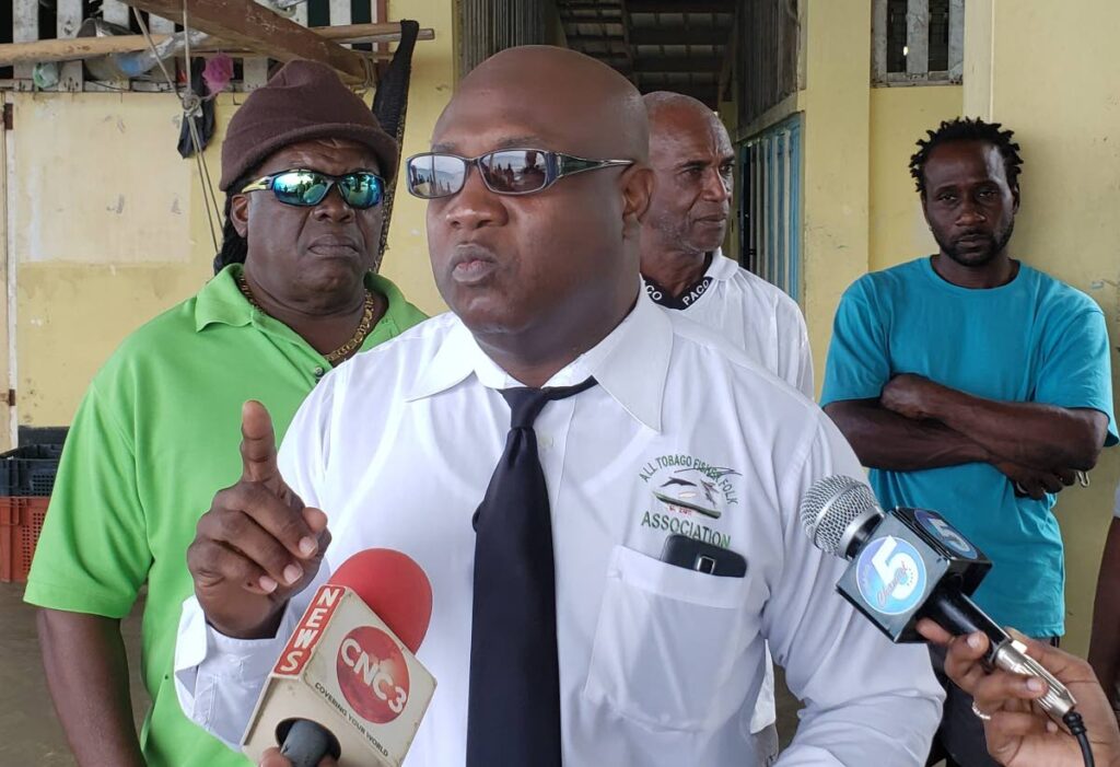 All Tobago Fisherfolk Association president Curtis Douglas, centre, said the organisation should have been invited to the recent energy conference in Trinidad. File photo