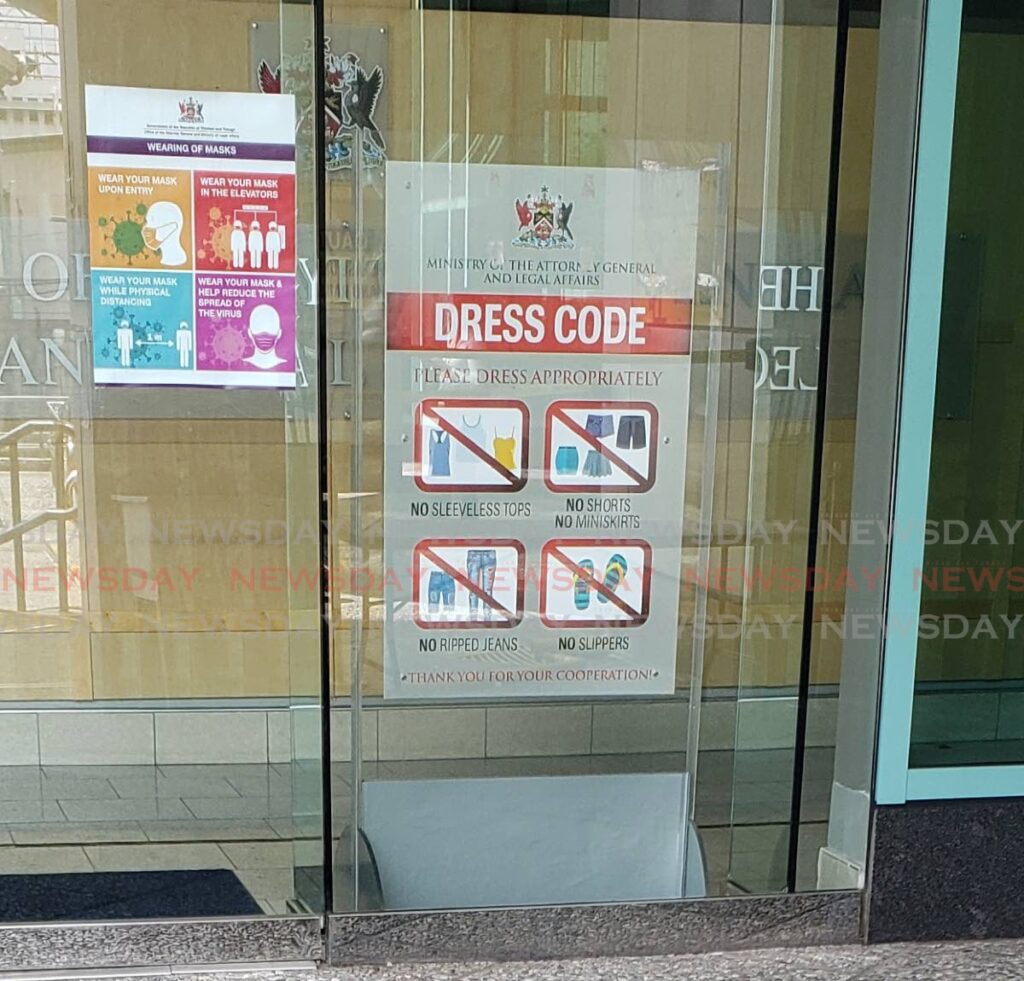 A sign advises the public of the dress code to enter the Ministry of the Attorney General and Legal Affairs. - ROGER JACOB