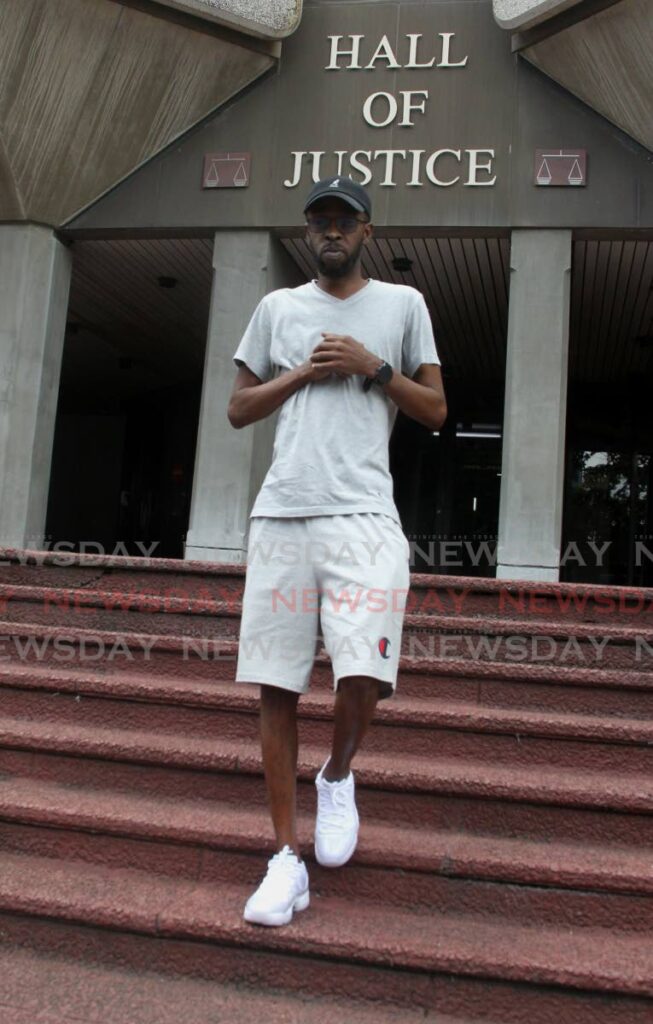 In this file photo, former murder accused Akili Charles stands outside the Hall of Justice in July 2022. Charles filed the landmark case which now allows people accused of murder to get bail. - File photo/ROGER JACOB