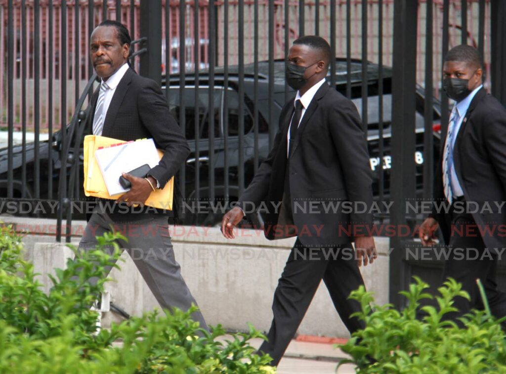 File photo: National Security Minister Fitzgerald Hinds, left.