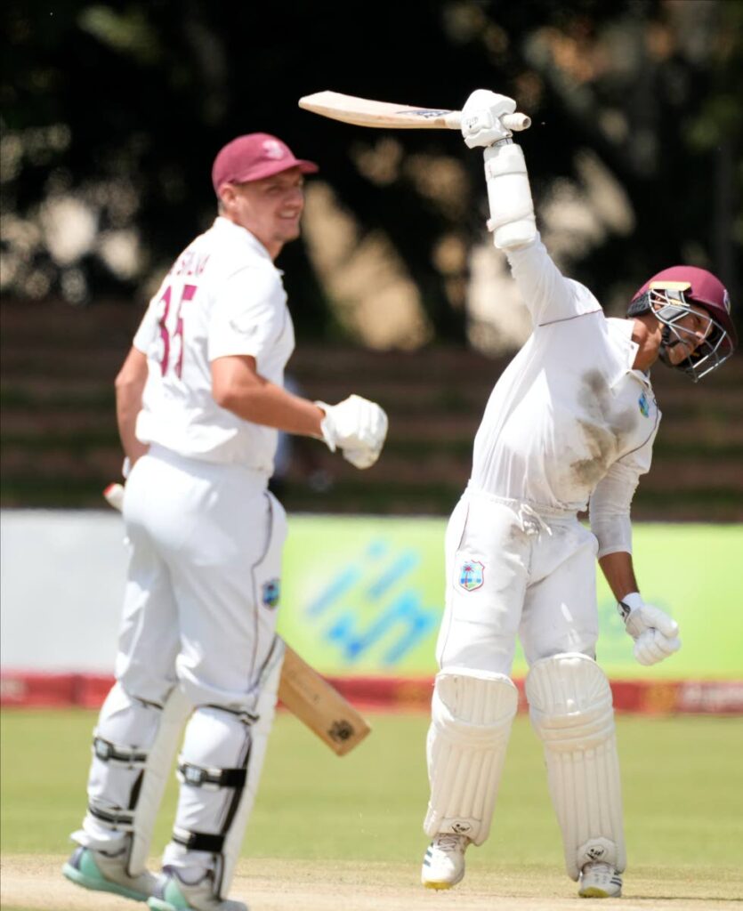 West Indies batsman Tagenarine Chanderpaul (R) celebrates after scoring 200 runs on the third day of the first Test against Zimbabwe at Queens Sports Club in Bulawayo, Zimbabwe, on Monday. (AP Photo) - 