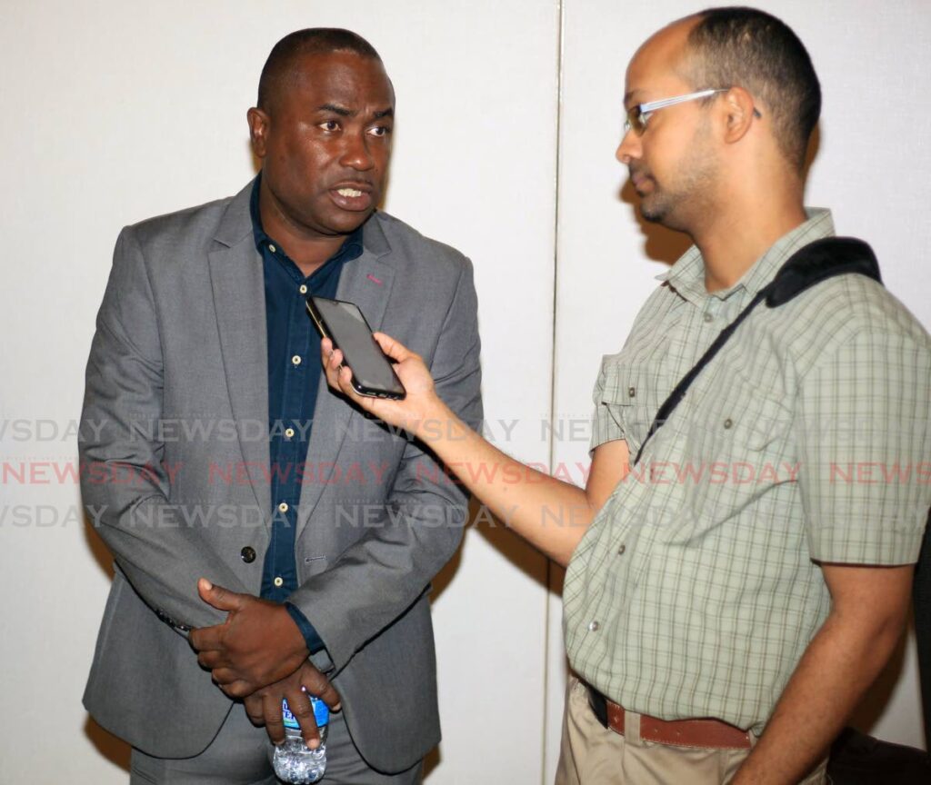 Trinidad and Tobago senior men's football team head coach Angus Eve (L) speaks with Newsday reporter Jelani Beckles, on Monday, at the launch of the TT Premier League, at the Hyatt Regency, Port of Spain. - Photo by Roger Jacob
