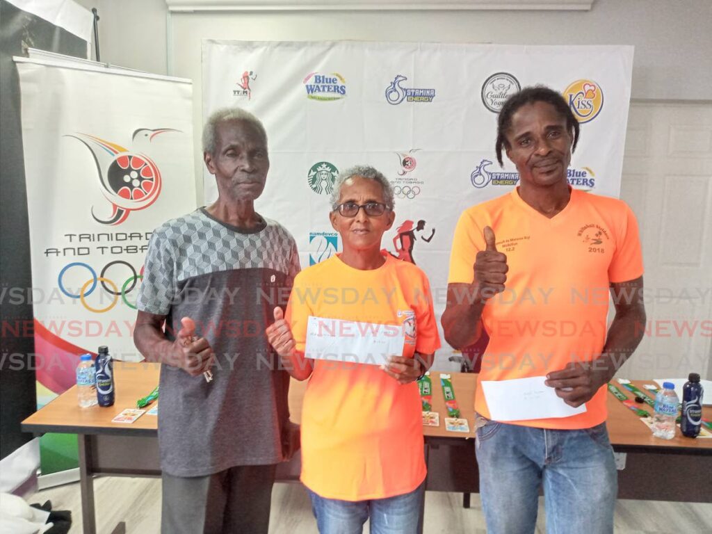 TT International Marathon 2023 runners Errol Jones, from left, Susannah Joefield and Nigel Simon celebrate after receiving their awards for being among the event’s top performers, on Monday, at the TT Olympic Committee’s headquarters, Woodford Street, Port of Spain.  - Jelani Beckles