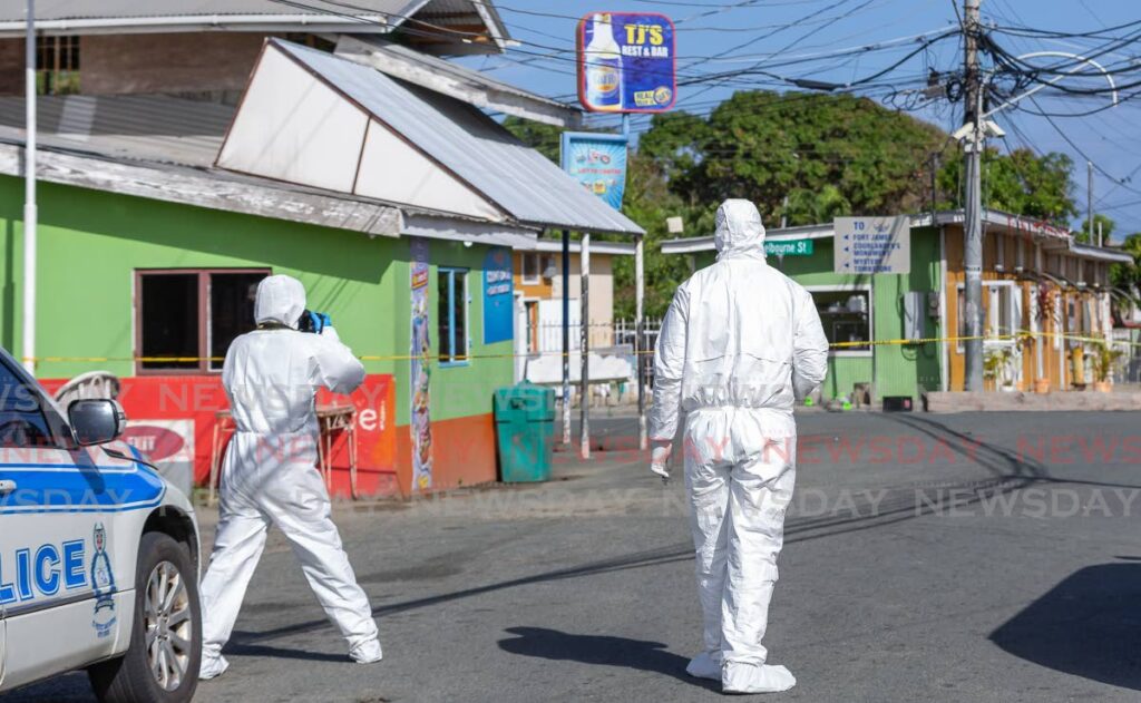 Crime-scene investigators on the scene after THA worker Nigel Sandy was gunned down at Shelbourne Street, Plymouth on February 9. - David Reid