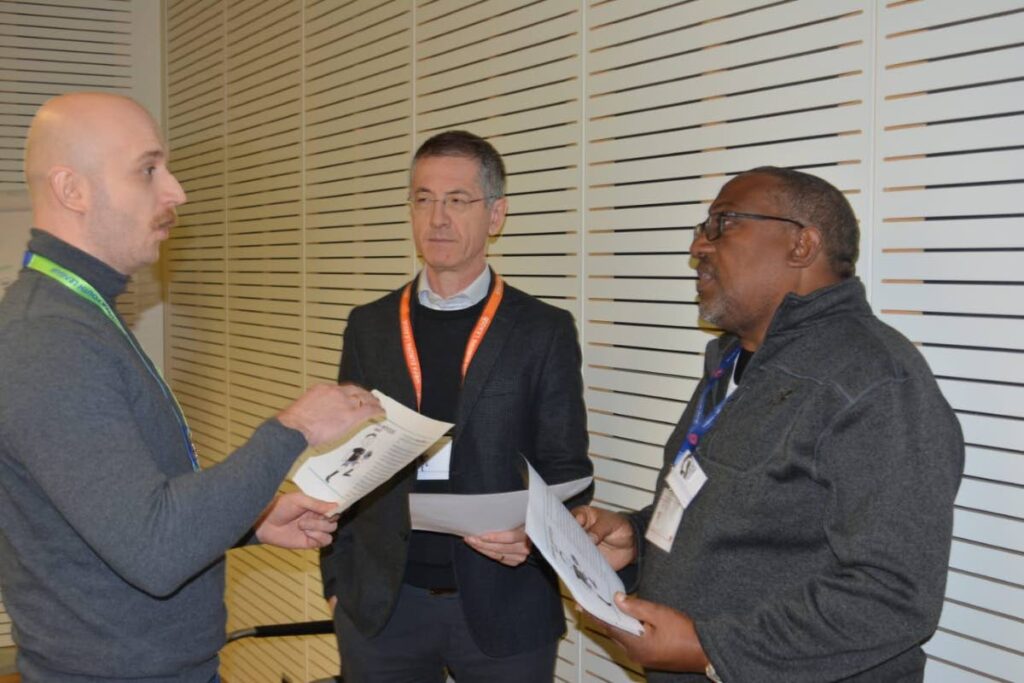 Guyana men's senior football coach Jamaal Shabazz, right, speaks with other participants at a UEFA course in Switzerland recently. - 